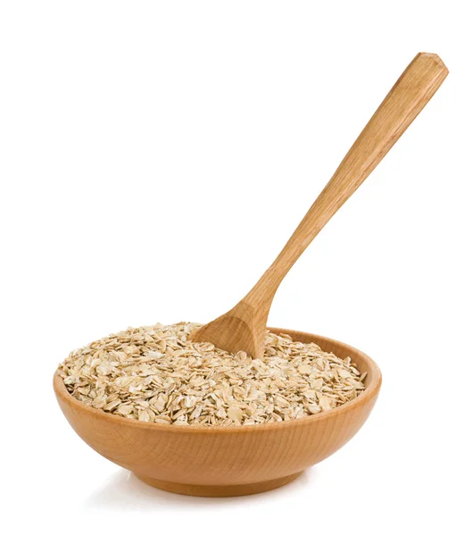 Floco de cereais em placa de madeira sobre branco — Fotografia de Stock