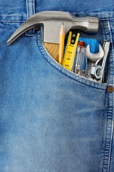 Tools in old blue jeans — Stock Photo, Image