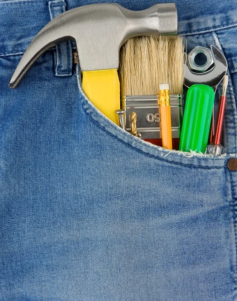 Set of tools and instruments in old blue jeans — Stock Photo, Image