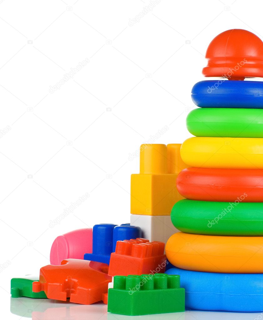 Colorful plastic child toys and bricks isolated on white
