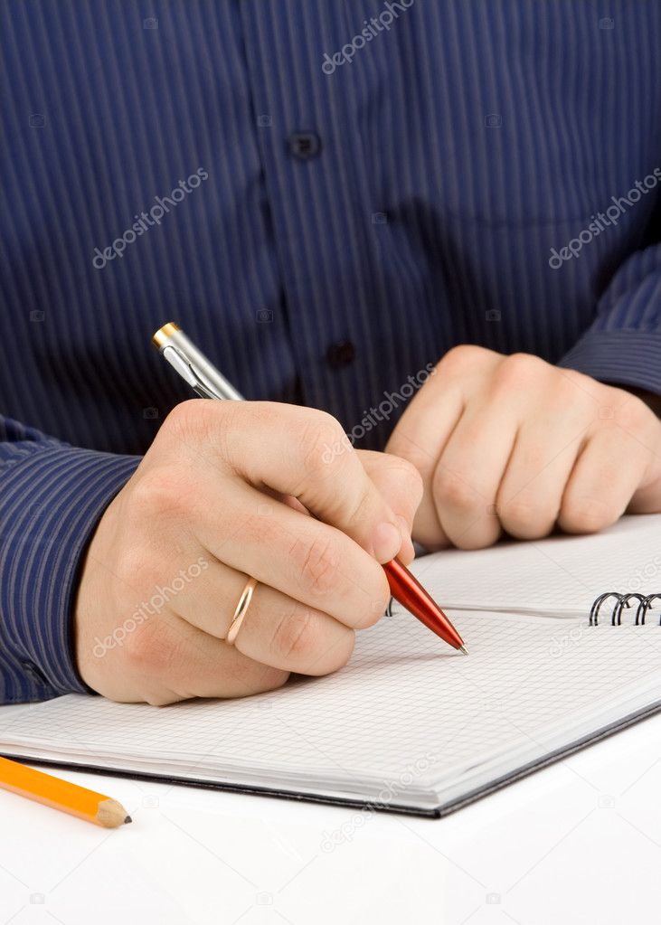 Hand writing by pen on checked notebook