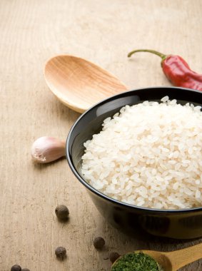 Uncooked rice in bowl clipart