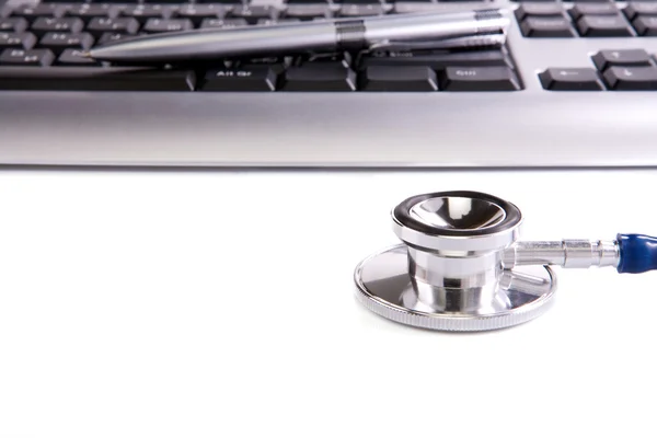 Stethoscope, pen, and keyboard — Stock Photo, Image