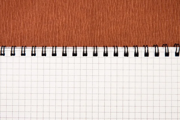 Rode achtergrond textuur en notebook — Stockfoto