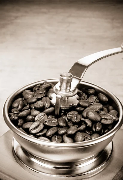 Coffee grinder and roasted beans — Stock Photo, Image