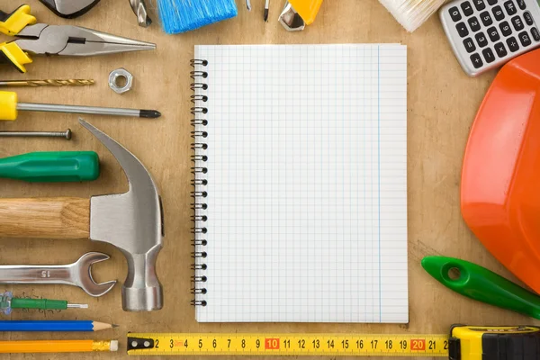 Construction tools and notebook — Stock Photo, Image
