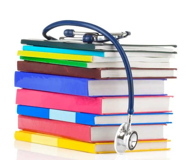 Stethoscope and pile of books — Stock Photo, Image