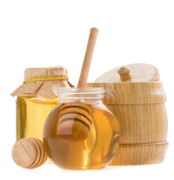 Sklo hrnec medu a hůl — Stock fotografie