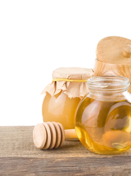 Miele in vaso su sfondo bianco — Foto Stock