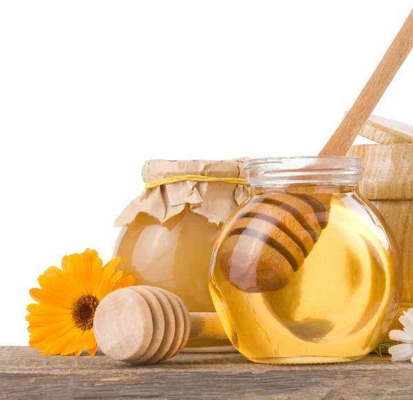 Honey and flowers — Stock Photo, Image