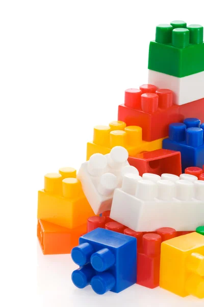 Kleurrijke plastic speelgoed op wit — Stockfoto