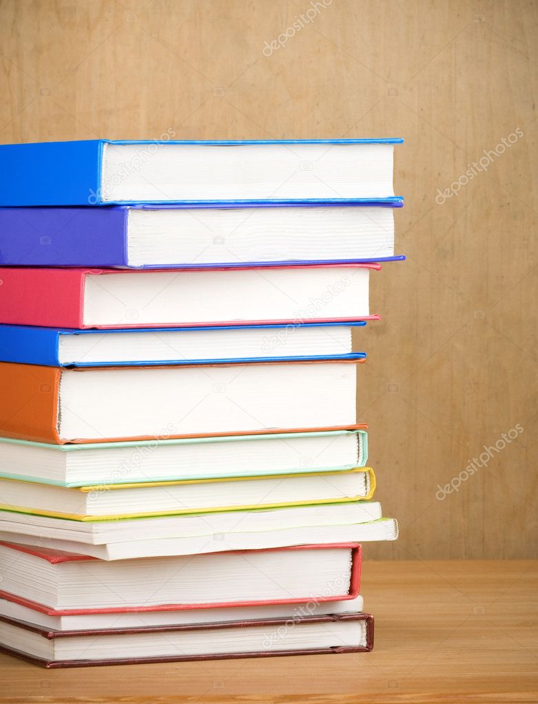 Books on wood background