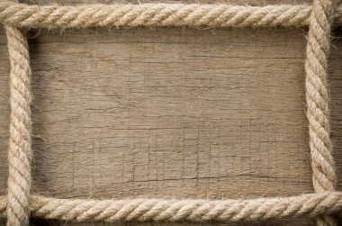 Ship ropes on wood background clipart