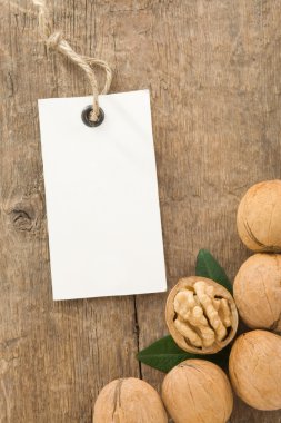 Walnuts fruit on wood background clipart