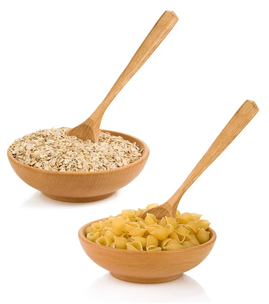 Raw pasta and oat cereals in plate — Stock Photo, Image