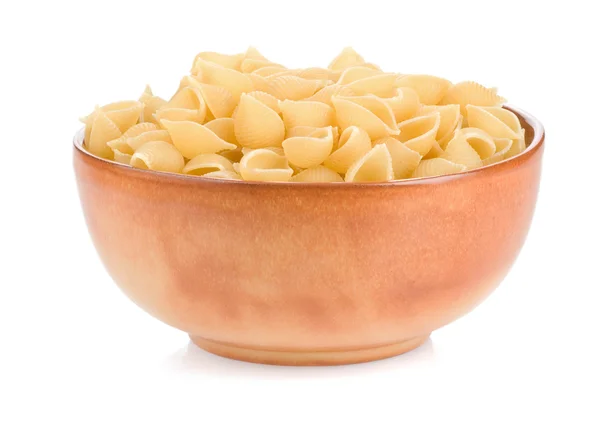 Ruwe pasta en plaat op wit — Stockfoto