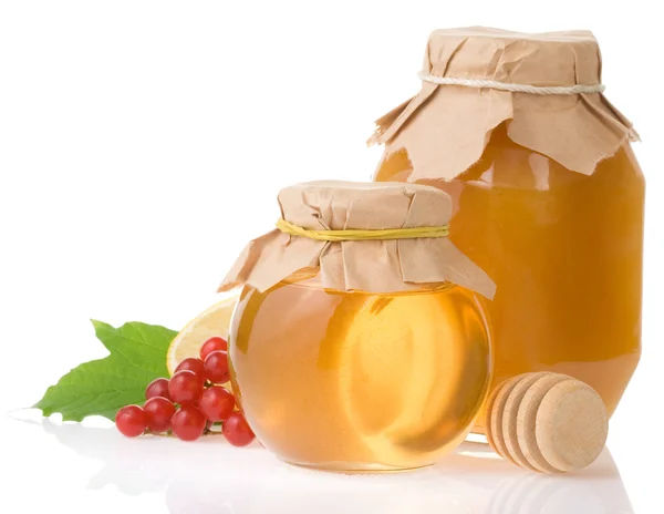 Jar of honey and fruit isolated on white — Zdjęcie stockowe