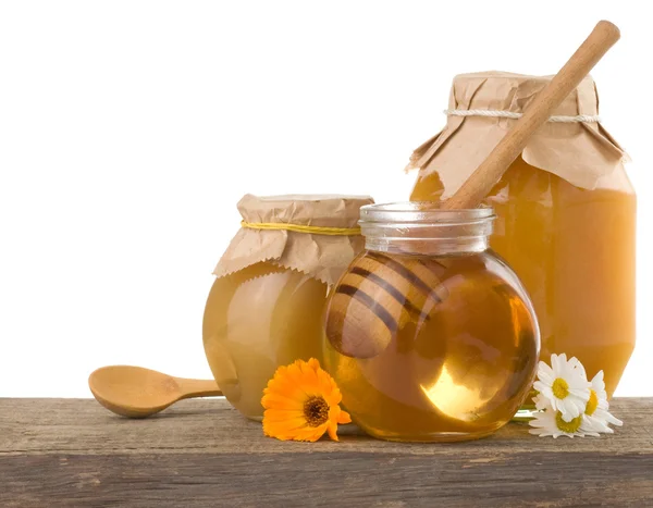 Miel en frasco aislado sobre fondo blanco — Foto de Stock