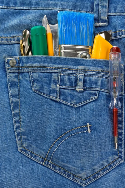 Verktyg och instrument i blå jeans — Stockfoto