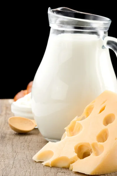 Milk products and cheese isolated on black — Stock Photo, Image