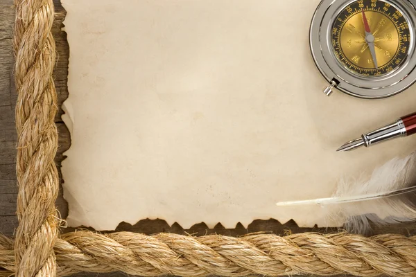 Ropes and compass on old vintage paper background — Stock Photo, Image