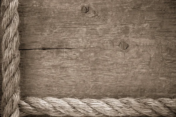 Câbles de navire bordures sur fond de bois — Photo