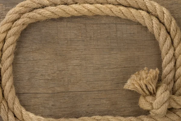 Ship ropes borders on wood background — Stock Photo, Image