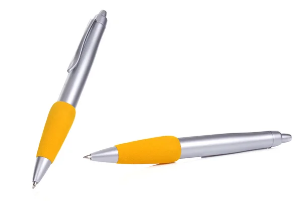 Silberne und gelbe Kugelschreiber — Stockfoto