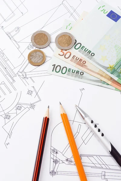 Pens and euro on drafting of construction machine — Stock Photo, Image