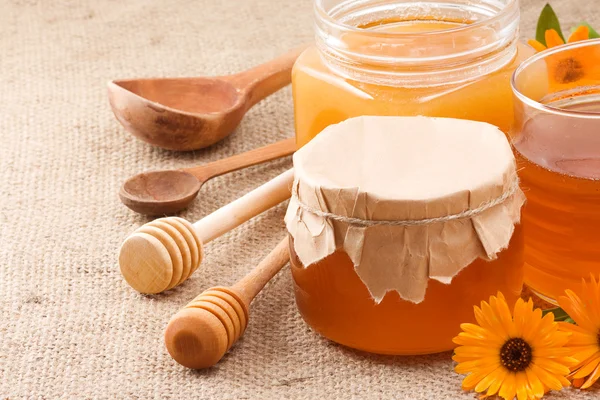 Glass jar and honey — Stock Photo, Image