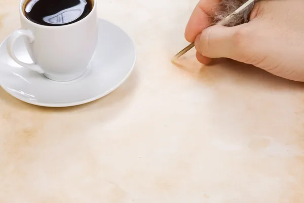 Coffee and writing hand — Stock Photo, Image