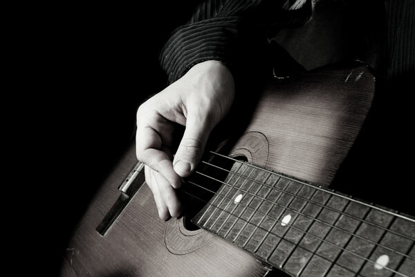 Closeup guitar and man hand