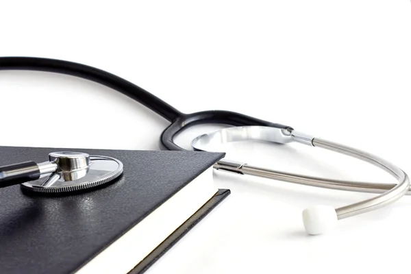 Black book and stethoscope — Stock Photo, Image