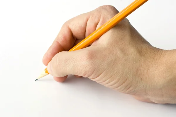 Writing hand and yellow pencil — Stockfoto