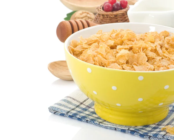 Bowl of corn flakes and milk isolated on white — Stockfoto