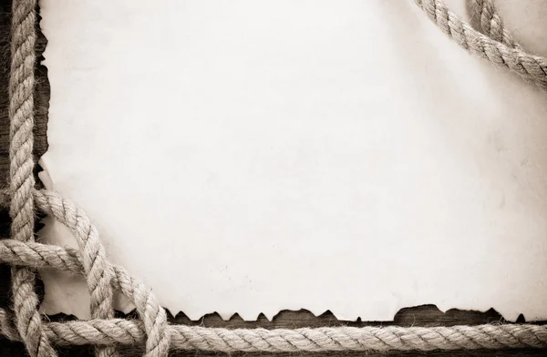 在旧复古古纸羊皮纸上船绳 — 图库照片