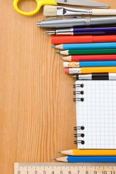 School supplies and checked isolated on white — Stock Photo, Image