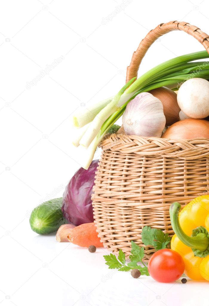 Healthy vegetable food and basket isolated on white