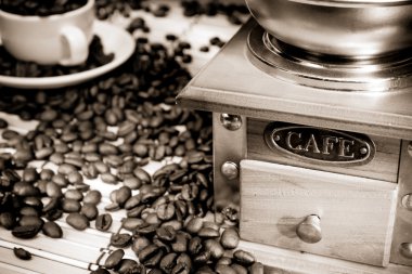 Coffee beans and wood grinder on sack clipart