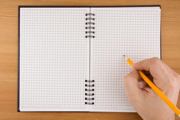 Escritura a mano a lápiz en cuaderno —  Fotos de Stock