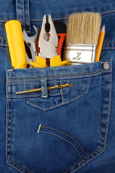 Tools and instruments in blue jeans — Stock Photo, Image