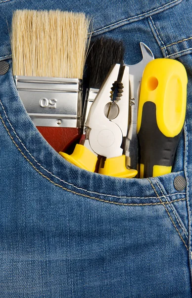 Tools and instruments in jeans pocket — Stock Photo, Image
