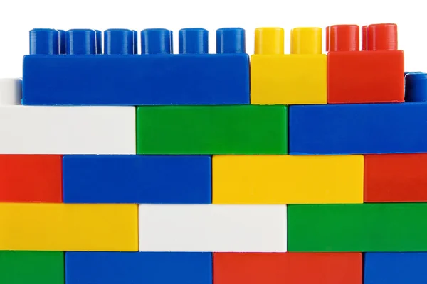Assemble of colorful plastic bricks isolated on white — Stock Photo, Image