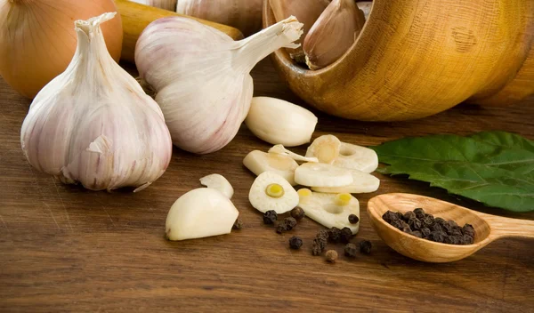 stock image Set of garlic and spice on wood