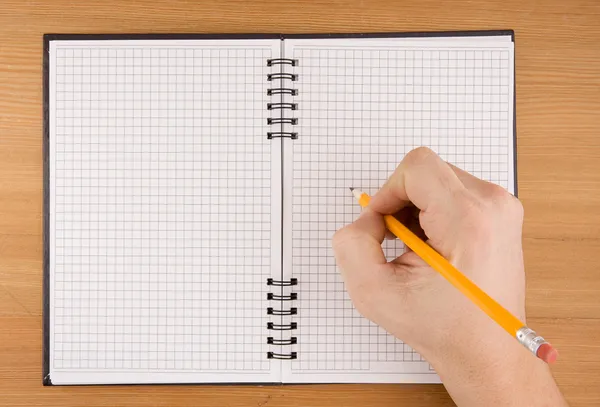 Hand writing by pencil on notebook Stock Image