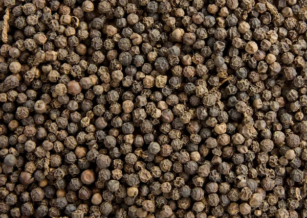 Black pepper as background Stock Picture
