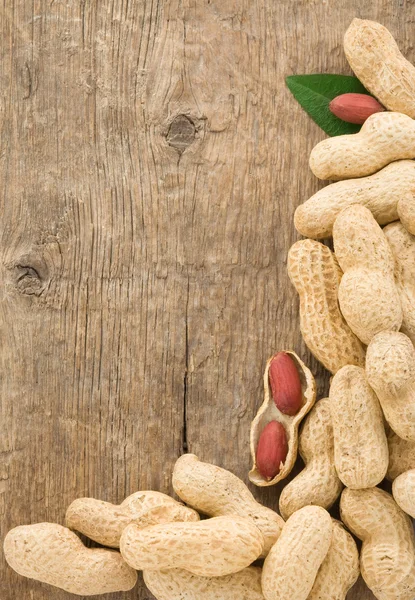 Pistachios nuts fruit on wood background — Stock Photo, Image