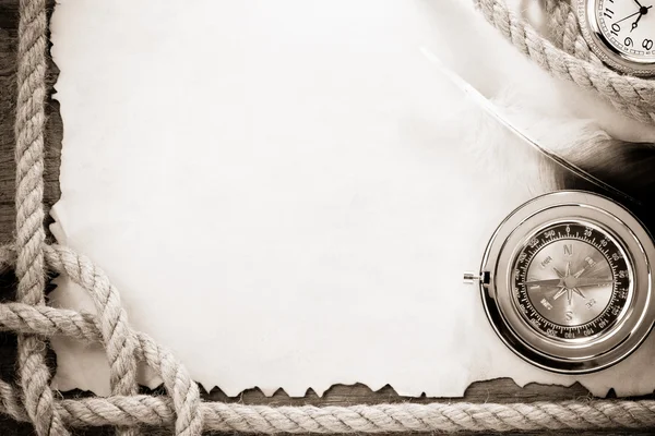 Ropes and compass on vintage ancient paper background — Stock Photo, Image