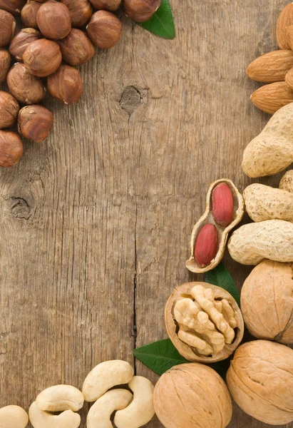 Set of nuts fruit on wood background — Stock Photo, Image