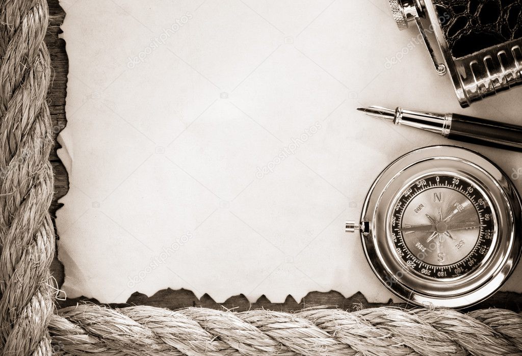 Ropes and compass on old vintage ancient paper